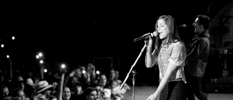 Cassadee Pope performing in a live black-and-white video performance of Bon Jovi's "Bed of Roses."